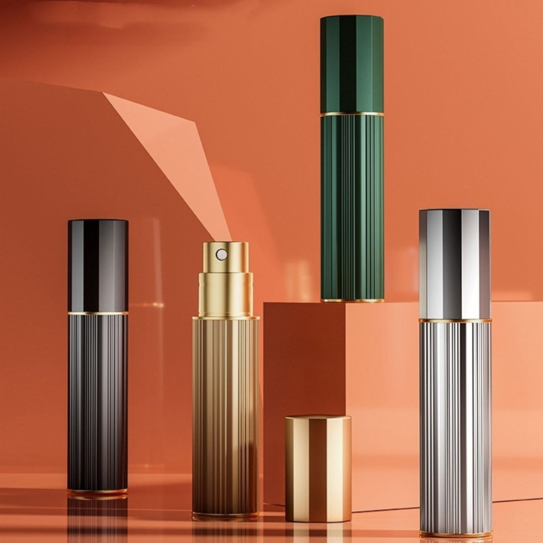 Travel perfume atomiser set of three ribbed metal sprayers with capped tops and gold rings