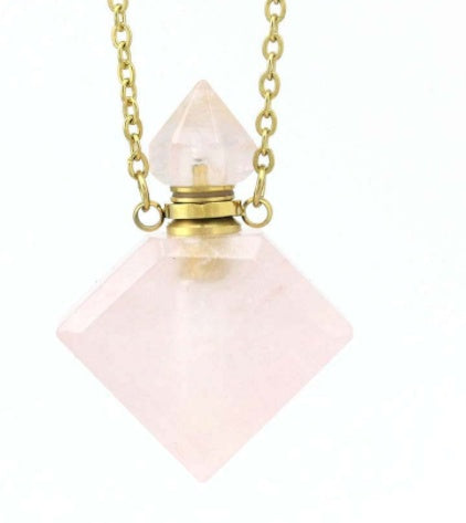 Light pink diamond perfume pendant with gold cap and chain, faceted crystal drop