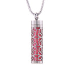 Aroma pendant cylinder with red floral cutout pattern and silver-tone cap on chain