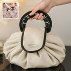 Black drawstring wash bag with oval loop handle and Tea Break patch