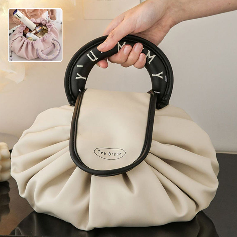 Black drawstring wash bag with oval loop handle and Tea Break patch