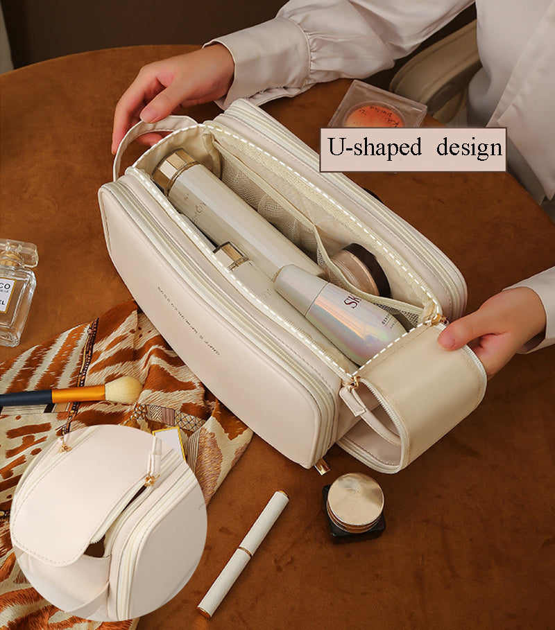 White vanity case opened to show U-shaped interior divider and elastic slots for items
