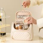 Milky white vanity bag, open with mesh organizer pockets and zip compartments