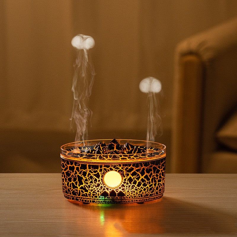 Black volcano aroma diffuser with glowing light, cracked pattern, smoke rising from rocks