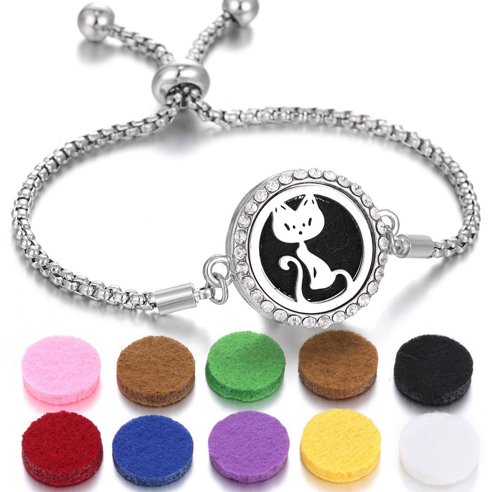 The Ritual Aroma Bracelet in silver-tone with black cat locket; felt aroma pads included