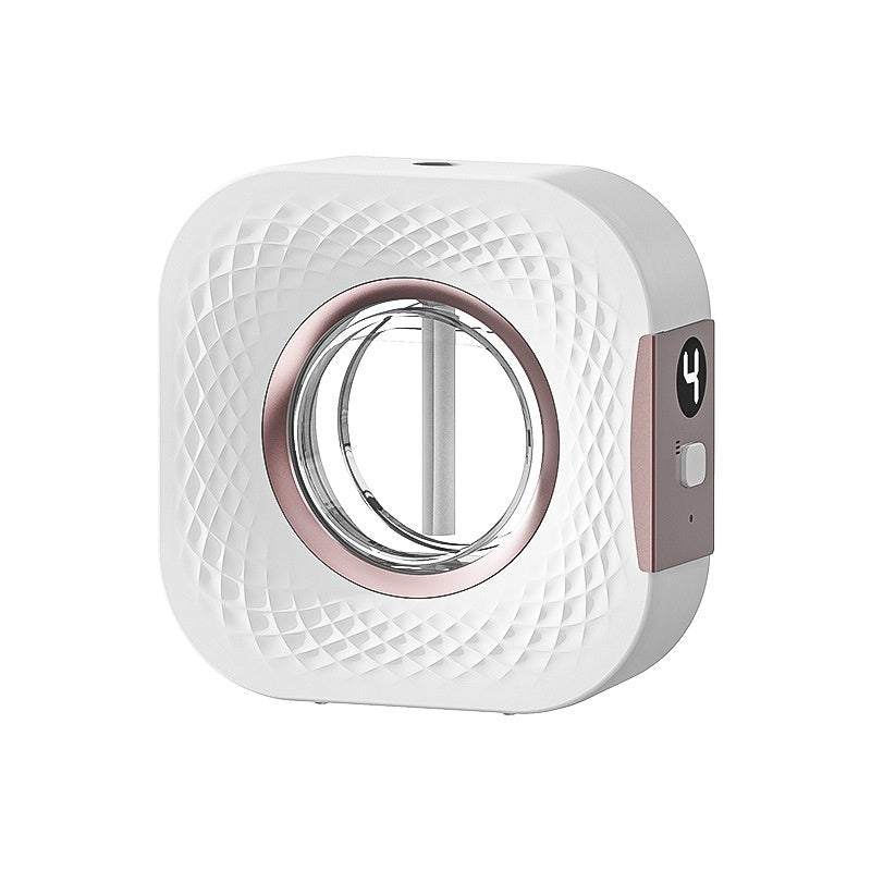 White aerosol diffuser front view with metallic circular opening and side button