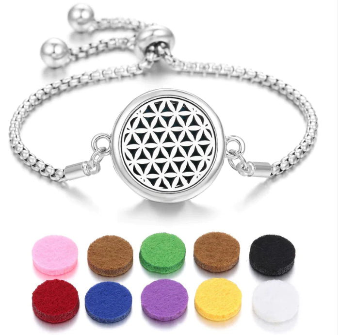 The Ritual Aroma Bracelet in silver tone with black geometric locket and color pads