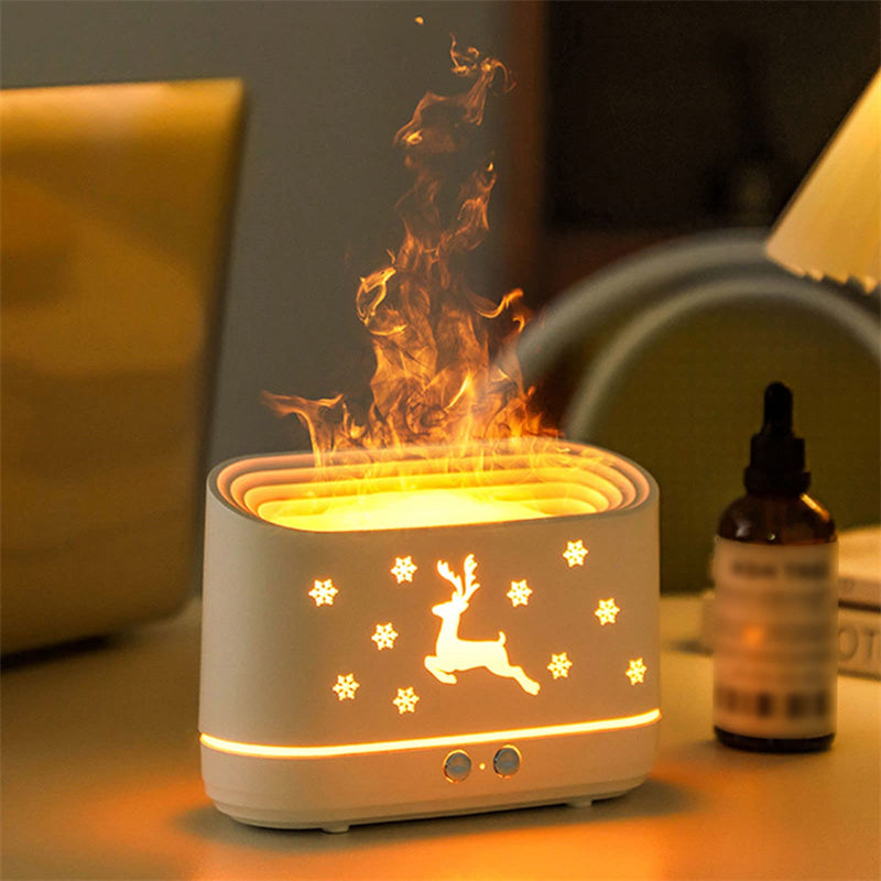 Ivory white elk diffuser glowing with light ring; deer silhouette and snowflake pattern on front