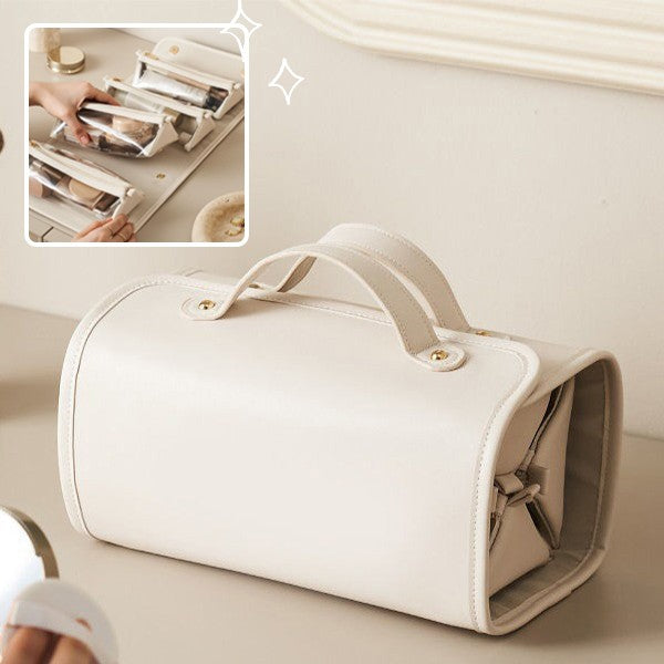 Light beige folding travel vanity bag with carry handles and snap closure.