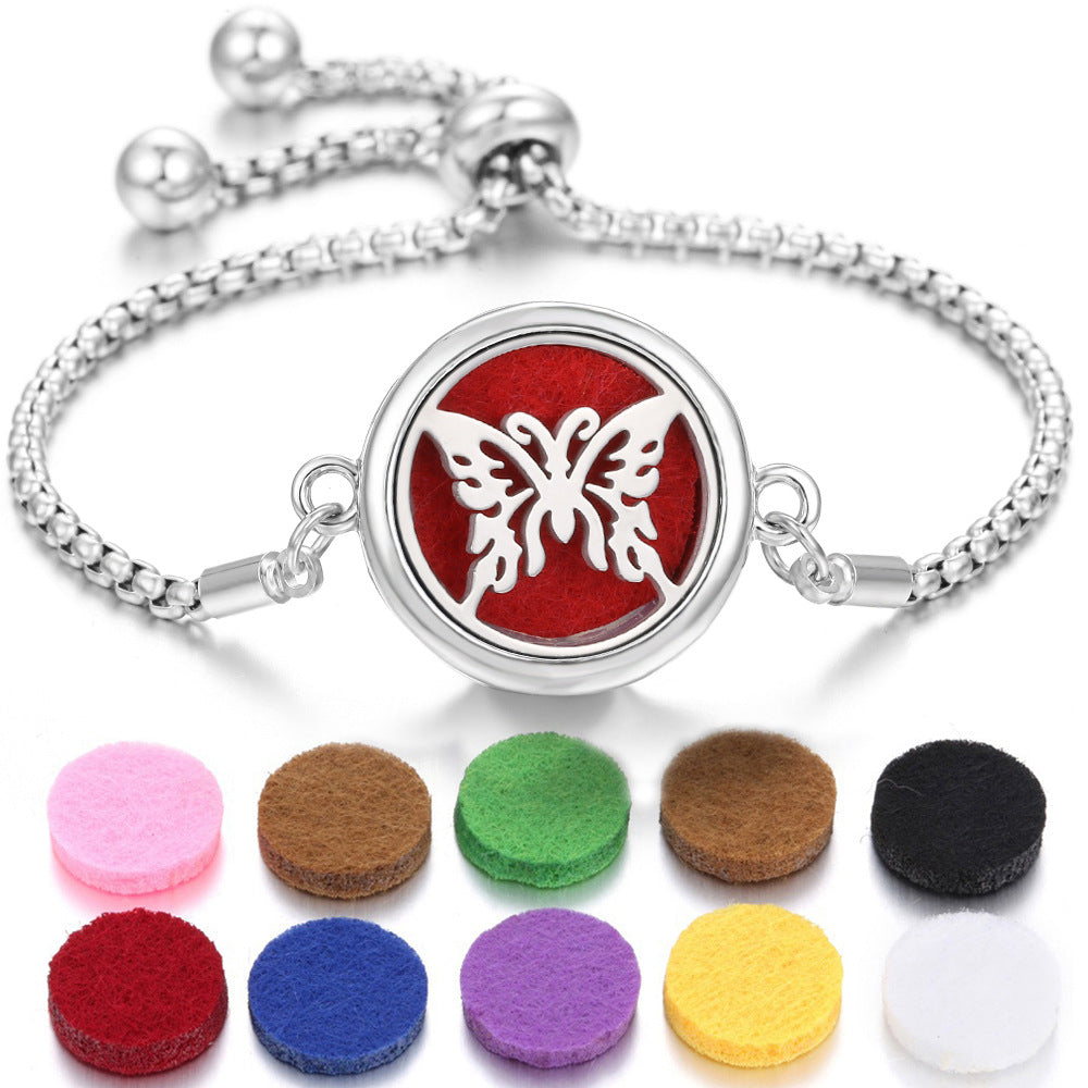 Silver-tone Ritual Aroma Bracelet with butterfly red locket and aroma color pads