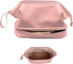Pink cosmetic case with zipper and wrist strap, open base tray