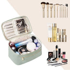 Structured travel vanity pouch with zip-top, open interior compartments, mint green shell