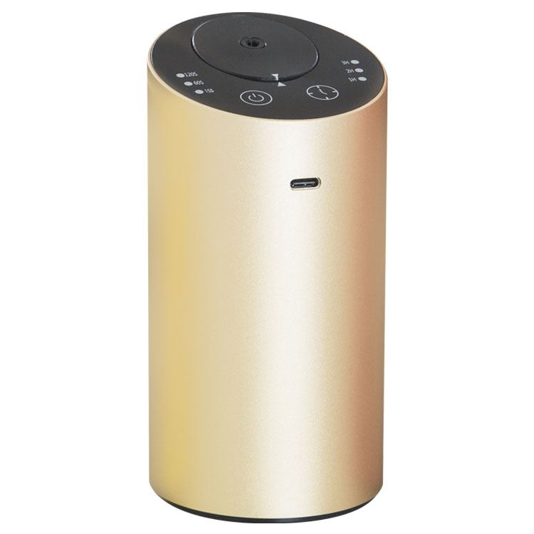 Gold cylindrical portable USB diffuser with top control panel and USB charging port.