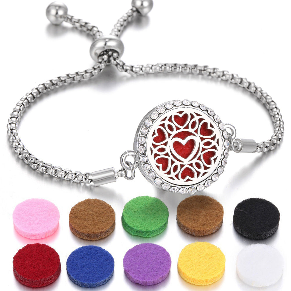 Aroma bracelet with silver-tone chain and red heart mandala locket; includes felt pads