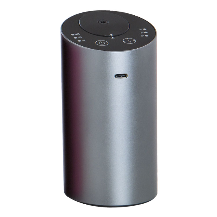 Silver cylindrical portable USB diffuser with top control icons and USB charging port.