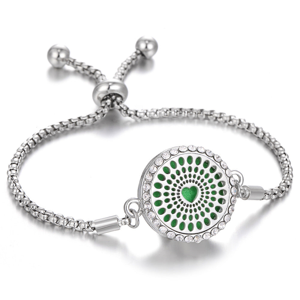 Silver-tone aroma bracelet with green dot mandala locket and adjustable clasp